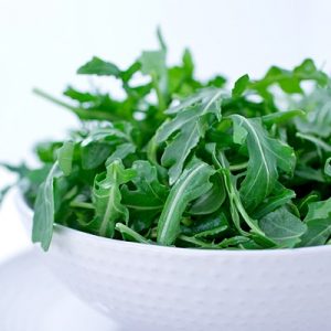 A Salad of Arugula Leaves in a bowl. Shallow dof